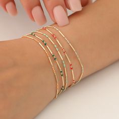 Elevate your accessory game with our stunning 14K Solid Gold Enameled Bar Bracelets, designed to shine as brightly as you do. Each bracelet features a delicate, mini Italian balls chain that exudes elegance, making it the perfect addition to any outfit--whether you're dressing up for a night out or adding a touch of flair to your everyday look. With a thoughtful design that showcases 12 vibrant birthstone colors, this bracelet allows you to express your individuality or celebrate loved ones with Green Jewelry With Colorful Beads For Birthday, Green Beaded Jewelry For Birthday, Green Colorful Beads Jewelry For Birthday, Gold Beaded Bracelets With Colorful Beads For Birthday, Multicolor Tiny Beads Jewelry For Birthday, Gold Bracelets With Colorful Beads For Birthday, Gold Bracelets With Colorful Beads For Festive Occasions, Festive Gold Bracelets With Colorful Beads, Multicolor Jewelry With Gold Beads For Gift