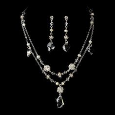 "Stylish and elegant, this silver or gold plated necklace and earring set is the perfect accessory for your wedding, honeymoon or special occasion. The set features freshwater pearls and clear Swarovski crystals, the perfect finishing touch to your vintage chic or classic wedding dress. READY TO SHIP DETAILS: - Necklace: 15\" long with a 2.5\" adjustable extender, Earrings: 1.5\" long. - Earrings - 2\" (Length) - Offered in Gold or Silver COORDINATING SASHES, CUFF BRACELETS & FASCINATORS, VI Classic Sterling Silver Jewelry Sets For Wedding, Silver Jewelry Sets With Pearl Drop For Formal Occasions, Gold Sterling Silver Jewelry Sets For Wedding, Classic Silver Crystal Jewelry Sets, Dangle Jewelry Sets For Wedding, Silver Crystal Jewelry Set With Pearl Drop, Silver Costume Jewelry Sets For Weddings, Elegant Silver Dangle Jewelry Sets, Classic Wedding Necklace With Matching Earrings