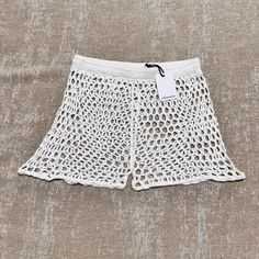 Olivaceous Nwt White Shorts Crochet Knit Elastic Coverup Swim Festival Brand New With Tags Size Large Waist - 13.75” Across Front Waistband Inseam - Approx 2” Get Ready For Some Fun In The Sun With These Stylish Olivaceous Crochet Shorty Shorts! Made Of 100% Acrylic Knit Fabric, They Are Both Comfortable And Stretchy, Making Them Perfect For Your Next Beach Or Casual Outing. The Elastic Waistband Ensures A Comfortable Fit, While The Solid White Color And Crochet Accents Add A Touch Of Elegance T White Open Knit Bottoms For Summer, White Crochet Beach Bottoms, White Crochet Bottoms For Beach, White Crochet Bottoms For Vacation, Casual Spring Bottoms With Crochet Lace, White Casual Bottoms With Crochet Trim, Casual White Bottoms With Crochet Trim, Fitted Open Knit Bottoms For Summer, Summer Cotton Bottoms With Crochet Lace