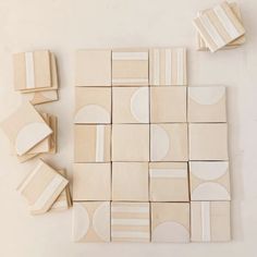 several pieces of white and beige tile sitting on top of each other