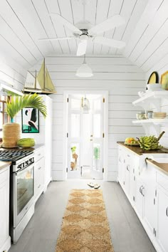 the kitchen is clean and ready for us to use it's natural wood flooring