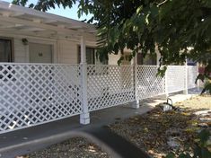 a house with a white fence next to it