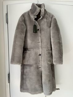 Women’s ALLSAINTS Serra Reversible Long Sheepskin Shearling Coat NWT | eBay Sheepskin Fur Coat With Faux Fur Lining For Work, Classic Long Shearling Coat, Classic Allsaints Winter Outerwear, Allsaints Classic Winter Outerwear, Elegant Luxury Shearling Outerwear, Luxury Hooded Shearling Outerwear, Luxury Long Sleeve Shearling Outerwear, Shearling Outerwear With Faux Fur Lining, Long Coat, Shearling Coat