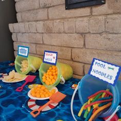 there are some food items on the table for kids to eat and play with them