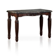 an antique wooden table with marble top