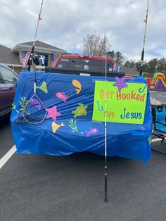 a blue table covered with a sign that says hooked up in jesus