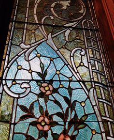 a stained glass window with flowers on it