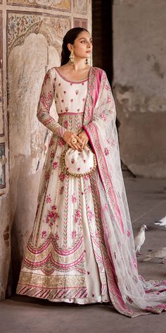 Premium Pakistani Wedding Dress in Open Frock Lehenga Style comes in premium quality fabric. This Lehenga Dress is a perfect balance of trend and tradition. Embroidery and floral designs make this Pakistani Dress an epitome of beauty and your priority to have a magnificent look. Pakistani Lehenga, Wedding Dresses Pakistani, Dupatta Border, Lehenga Dress, Raw Silk Lehenga, Pakistani Designer Clothes, Raw Silk Fabric, Pakistani Wedding Dress, Lehenga Style