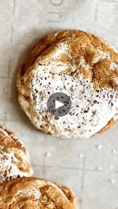 two round pastries covered in powdered sugar