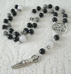 "This beautiful wiccan rosary has black obsidian beads, onyx beads, sterling silver plated bead caps, sterling silver plated filigree beads, pewter silver pentacle and a pewter silver goddess. A lovely way to pray to the Goddess and meditate. 20\" long." Mystical Black Jewelry For Healing, Goddess Magic, Silver Goddess, Pagan Prayer, Wicca Jewelry, Witch Crafts, Wiccan Jewelry, Pagan Jewelry, Onyx Bead