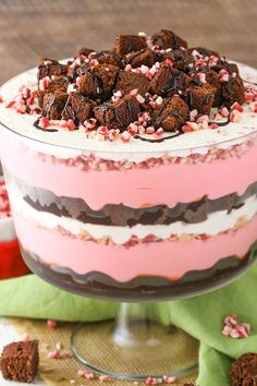 a layered cake with chocolate and candy canes on top