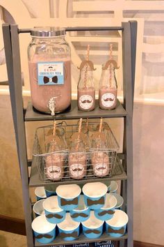 a shelf filled with lots of drinks and desserts