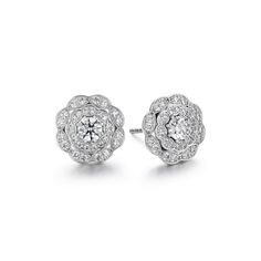 Our classic Lorelei Diamond Halo Stud Earrings get a little extra sparkle in this double halo design. These studs have show-stopping style but a silhouette to suit your everyday. MATERIAL: 18K White Gold GEMSTONE: Diamonds, 66 qt STONE WEIGHT: 0.70 ct STONE COLOR: GH STONE QUALITY: VS-SI STONE SHAPE: Round Brilliant-Cut DIMENSIONS: Depth 3.95 mm, Width 10.40 mm, Length 10.40 mm REF: HFELORDBLH00708W Halo Stud Earrings, Halo Design, Halo Earrings Studs, Double Halo, Diamond Stud Earrings, Diamond Stud, Diamond Halo, Round Brilliant Cut, Diamond Earrings Studs