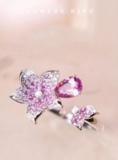 •Condition: Brand new•Center Stone: Natural Pink Sapphire, Pear Cut, approx 0.92ct•Side stones: Natural White Diamond round-cut (VS1 clarity and F color)Natural White Sapphire, Marquise cut•Ring Weight: 2.65ct•Ring Dimension: 19.8x19mm•Metal Purity: Optional Each piece is made-to-order with care and special attention to detail. all items are made with conflict-free diamonds and gems.Size: made to orderThe item will be gift wrapped and shipped.----------------------------------------------------- Elegant Multi-stone Diamond Ring With Pink Sapphire, Diamond Multi-stone Flower Ring, Flower Shaped Diamond Ring With Multi-stones, Luxury Cubic Zirconia Flower Ring, Exquisite Flower Shaped Gemstone Rings, Elegant Multi-stone Diamond Flower Ring, Elegant Multi-stone Flower Ring, Elegant Flower-shaped Multi-stone Rings, Pink Diamond Flower Shaped Ring