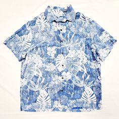 Get ready for your next tropical adventure with this X-Large Caribbean Blue & White TROPICAL Leaves Floral Hawaiian Shirt! Lightweight, comfortable, and perfect for any occasion, this shirt features a textured fabric and side slits for a relaxed fit. Machine washable and preshrunk. #HawaiianShirts #TropicalVibes #MensFashion 🌺🌴  #Hawaiian #Floral #Blue #XL #Men #ButtonDown #Carribean #Lightweight #ButtonUp #Tropical #Classic #Regular #Outdoor #Travel White Cotton Hawaiian Button-up Shirt, Blue Printed Hawaiian Button-up Shirt, Blue Floral Print Hawaiian Button-up Shirt, Blue Hawaiian Shirt With Graphic Print, Relaxed Fit, Tropical Adventure, Floral Hawaiian Shirt, Button-up Hawaiian Shirt With Palm Tree Print For Beach, Caribbean Blue, Tropical Vibes