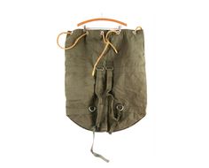 an army green bag hanging on a hook