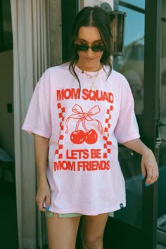 Mom Squad Lets Be Mom Friends oversized pink tee with red featuring cherry & bow graphics. Back print says Lets Be Mom Friends. Karrie is wearing a size 2XL. Features 6.1 oz./yd² (US), 10 oz/L yd (CA), 100% ring-spun cotton, 30 singles Garment dyed for that lived in feel and almost no shrinkage at home. Soft ring-spun cotton fabric with 100% cotton threads Relaxed fit Topstitched, classic width, rib collar Shoulder to shoulder twill tape New Best Friend Shirt, Mom Best Friends Shirts, Best Friends Shirt Cricut, Group Mom Shirts, Trendy Tshirt Designs, Pink Tshirt Outfit, Baggy Tshirts, Mom Aesthetic Outfit, Fabric Outfits