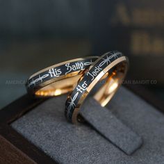 two wedding bands with the words his and hers engraved on them in gold or silver