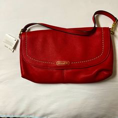 Beautiful And Soft Leather Coach Wristlet Red Coach Clutch As A Gift, Red Coach Clutch For Gift, Elegant Red Everyday Clutch, Classic Red Pouch Clutch, Red Coach Clutch Bag, Red Travel Clutch With Adjustable Strap, Red Handheld Clutch With Removable Pouch, Red Clutch With Adjustable Strap For Travel, Coach Red Clutch With Removable Pouch