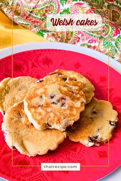 three pancakes on a red plate with the words, what to eat when you're in wales