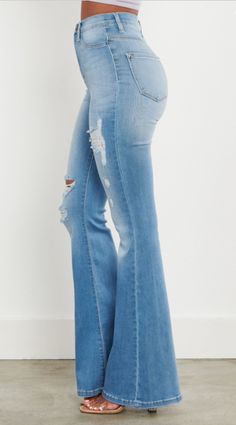 Elevate your denim collection with the Lara Distressed Flare Jeans, crafted from stretch denim for ultimate comfort and flexibility. Featuring a high-rise fit that accentuates your figure and a super soft fabric that's gentle on the skin, these jeans offer both style and comfort for all-day wear. With their full-length flare design, they effortlessly combine trendiness with versatility, perfect for any occasion. Fabric Content: 51% Cotton 35.4% Modal 6.4% T400 Lycra 1.1% Distressed Flare Jeans, Lara Jean, Denim Collection, Flare Jeans, Stretch Denim, Soft Fabric, Soft Fabrics, Full Length, Jeans Size