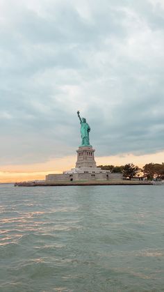 the statue of liberty is in the middle of the water