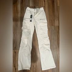 Fashion Nova Cargo White Pants. Size 3-With Tags. Never Worn. White Full Length Cargo Pants With Multiple Pockets, White Utility Cargo Jeans Full Length, White Utility Full Length Cargo Jeans, White High Rise Cargo Jeans, White Straight Leg Pants With Multiple Pockets, White Full Length Utility Cargo Jeans, High Rise White Cargo Bottoms, High Rise White Cargo Style Bottoms, White High Rise Cargo Bottoms