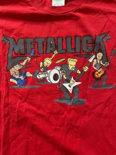 a red shirt with metallicica band on it