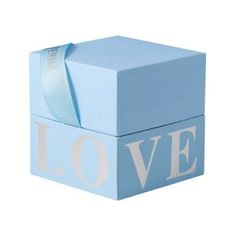 a blue box with the word love painted on it and a ribbon tied around the top