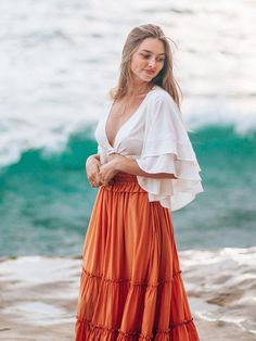 Available in both a cropped silhouette and regular length, our boho-chic wrap top is designed with voluminous flutter sleeves and a double-layered design to create a flowy look. Customize your fit with the long waist ties that can be secured in the front or back. Delicate lace details add a romantic finishing touch. It’s the perfect pairing with jeans, shorts, a maxi skirt or even a mini skirt. Double-layer flutter elbow-length sleeves V-neck Wrap-around self-ties at waist Lace details Cropped i Flowy Tops Outfit, Greek Outfit, Flowy Outfits, Dress Layering, Boho Inspo, Boho Summer Outfits, Crop Top Outfits, Layered Design, Midi Skirts