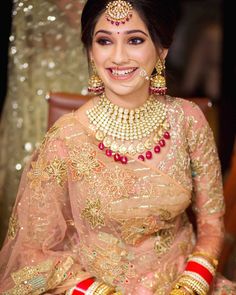 a woman in a bridal outfit sitting down