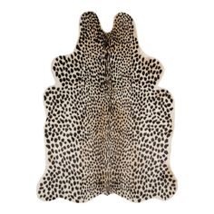 a white and black animal print rug with spots on it's back end,