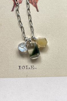 The Dainty chlorite charm inclusion has an amazing geometry formation of a green phantom-like formation with a triangle shape. Making this ultra-modern piece that is unlike the other crystal charms.  With a macro lens or your iphone zoom lens, you will see there is a light shimmer on the inclusions, which is due to tiny air pockets deposited during the crystal growth/crystal formation.  Materials + Measurement | approx. 0.9m (L) x 1.8cm (H)  x 0.6cm (W) | 1.5g Sterling Silver | S925 Stamp You will receive the exact item you selected shown in the video/picture. This listing is for one Pendant. Add on the necklace with customised length here https://www.etsy.com/listing/1491048361 All our shipping arrangements are with tracking. Free shipping with purchases over USD180 a single receipt. To s Green Spiritual Jewelry With Natural Inclusions, Spiritual Green Jewelry With Natural Inclusions, Unique Green Necklace With Natural Inclusions, Minimalist Green Moss Agate Jewelry, Crystal Growth, Garden Quartz, Crystal Formations, Be Natural, Ultra Modern