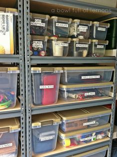 the shelves are filled with plastic containers and bins