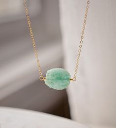 Aqua blue amazonite slice gemstone set onto a 14k gold filled chain. The stone is semi oval in shape, but irregular. It's smooth polished, but with raw edges. Amazonite Meaning, Amazonite Necklace, Colored Gems, Aqua Color, 14kt Gold, Sophisticated Style, Stone Necklace, Crystal Necklace, Handmade Jewelry