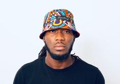 Size: 24 inches in diameter Reversible African print bucket hat Print: Makossa Teal and Aisha Multicolor Bucket Hat For Summer Streetwear, Multicolor 5-panel Hat For Streetwear, Casual Multicolor Bucket Hat For Streetwear, Fun Multicolor Reversible Hats, Trendy Multicolor 5-panel Hat, Trendy Reversible Multicolor Sun Hat, Multicolor Reversible Cotton Bucket Hat, Reversible Multicolor Cotton Bucket Hat, Trendy Multicolor Reversible Sun Hat