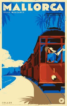 a train traveling down tracks next to a beach and palm tree covered hillside in front of a blue sky