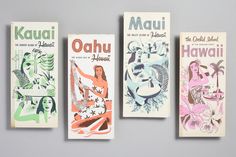 three hawaiian books are lined up against a gray background