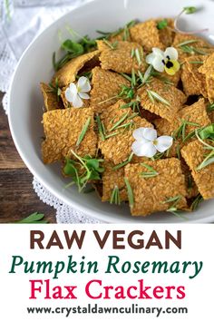 raw vegan pumpkin rosemary flax crackers in a white bowl with text overlay