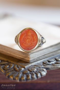 ✪ Carnelian Engraved Family Crest Signet Ring - Personalized Coat of Arms - Danelian Jewellery Workshop ✪ Danelian Jewellery with fine goldsmiths craftsmanship creates custom designs based on our client requests. Gold rings made with personalized specifications, your family crest, coat of arms, logo or any design imagined. ➤ Large variety of gemstones to create, with personalized engraving. ✔ Feeling inspired? Leave us your message to discuss now and see any bespoke jewelry brought to life. ♠ Ou Formal Carnelian Signet Ring With Polished Finish, Classic Carnelian Signet Ring With Polished Finish, Classic Carnelian Signet Ring For Anniversary, Classic Carnelian Round Signet Ring, Classic Round Carnelian Signet Ring, Anniversary Carnelian Signet Ring With Polished Finish, Antique Carnelian Intaglio Rings, Vintage Carnelian Signet Ring, Formal Carnelian Oval Signet Ring