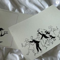 two greeting cards with black ink drawings of people dancing on white paper, and one has an image of a man holding a woman's hand