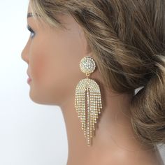 These Beautiful Romantic LONG Chandelier tassel Drop CRYSTAL BRIDAL EARRINGS are crafted with the finest quality of Swarovski Crystals, known for their exceptional brilliance and sparkle. These earrings are designed to add a touch of elegance and glamour to any bridal look, and the intricate design and radiant shine make them truly special. Even we had a hard time taking pictures because of their shine 😄 so we want to shine our brides on their special days. We understand the importance of a com Wedding Jewelry With Tassels, Crystal Dangle Chandelier Earrings For Celebration, Crystal Chandelier Dangle Earrings For Celebration, Gold Tassel Earrings For Wedding, Crystal Chandelier Dangle Earrings For Glamorous Events, Dangle Rhinestone Fringe Jewelry For Weddings, Glamorous Dangle Bridal Earrings For Glamorous Events, Silver Tassel Wedding Earrings, Elegant Rhinestone Fringe Chandelier Earrings For Evening