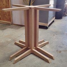 a wooden table that is in the process of being built and assembled with plywood