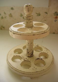 two tiered cake stand with holes in the middle