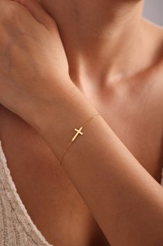 DAINTY CROSS  BRACELET *  GOLD CROSS BRACELET * Introducing our elegant 14K Gold Cross Bracelet, a timeless piece of dainty cross jewelry that exudes grace and sophistication. This beautiful religious bracelet features a delicate cross charm, making it a perfect accessory for women who cherish their faith. Crafted from high-quality 14K gold, this cross bracelet is designed to be both durable and stunning, ensuring it can be cherished for years to come. The minimalist design makes it versatile en Gold Cross Bracelet, Silver Cross Bracelet, Christian Gifts For Women, Bracelet Dainty, Cross Bracelet, Cross Jewelry, Sterling Silver Cross, Gold Cross, Cross Charms