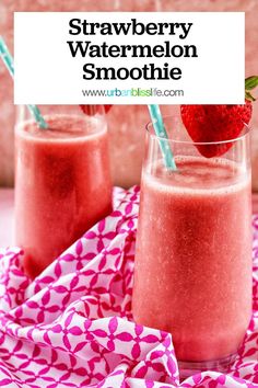 two glasses filled with strawberry watermelon smoothie on top of a pink cloth