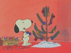 a cartoon dog standing next to a christmas tree