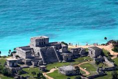 an aerial view of the ruins and surrounding water