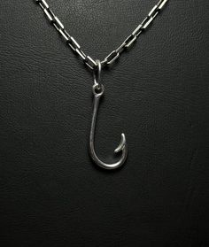 Personalized Solid Silver Handcrafted Fishing Hook Necklace Discover elegance and significance with our Solid Silver Handcrafted Fishing Hook Necklace, designed for both men and women. Crafted from 925 Sterling Silver, this necklace features intricate handmade details and can be personalized to add a special touch. Ideal for daily wear or as a thoughtful gift, this pendant is a beautiful way to celebrate meaningful moments. Why You'll Love It: Handcrafted Excellence: Each pendant is meticulously crafted with attention to detail. Elegant and Versatile: Complements any outfit with its sophisticated design. Customizable: Personalize with engravings for a unique touch or a memorable gift. Product Details: Material: 925 Sterling Silver Finish Options: Oxidized, Polished, Gold Plated, Rose Gold Sterling Silver Jewelry With Fish Hook For Gift, Sterling Silver Fish Hook Jewelry Gift, Adjustable Gold Jewelry With Fish Hook, Fishing Hook Necklace, Fly Fishing Necklace, Hook Necklace, Fishing Hook, Fisherman Gifts, Tarnished Silver