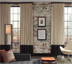 a living room filled with furniture and windows covered in curtained drapes on top of brick walls